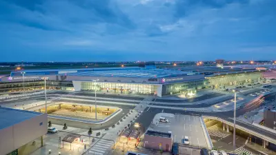 Traveler is looking at the airport display board