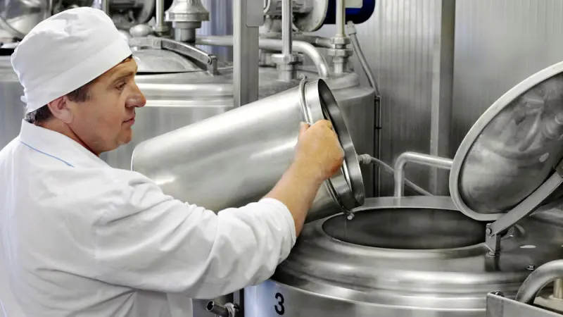 A man is pouring milk