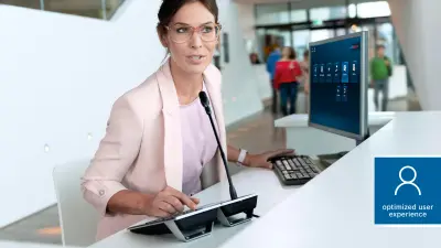 PRAESENSA call station being used by a receptionist