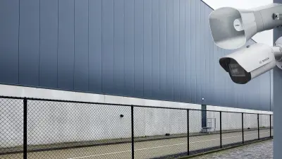 Bosch IP horn loudspeaker hanging at a wall with a dome video camera next to it