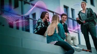 young men and women sitting on steps